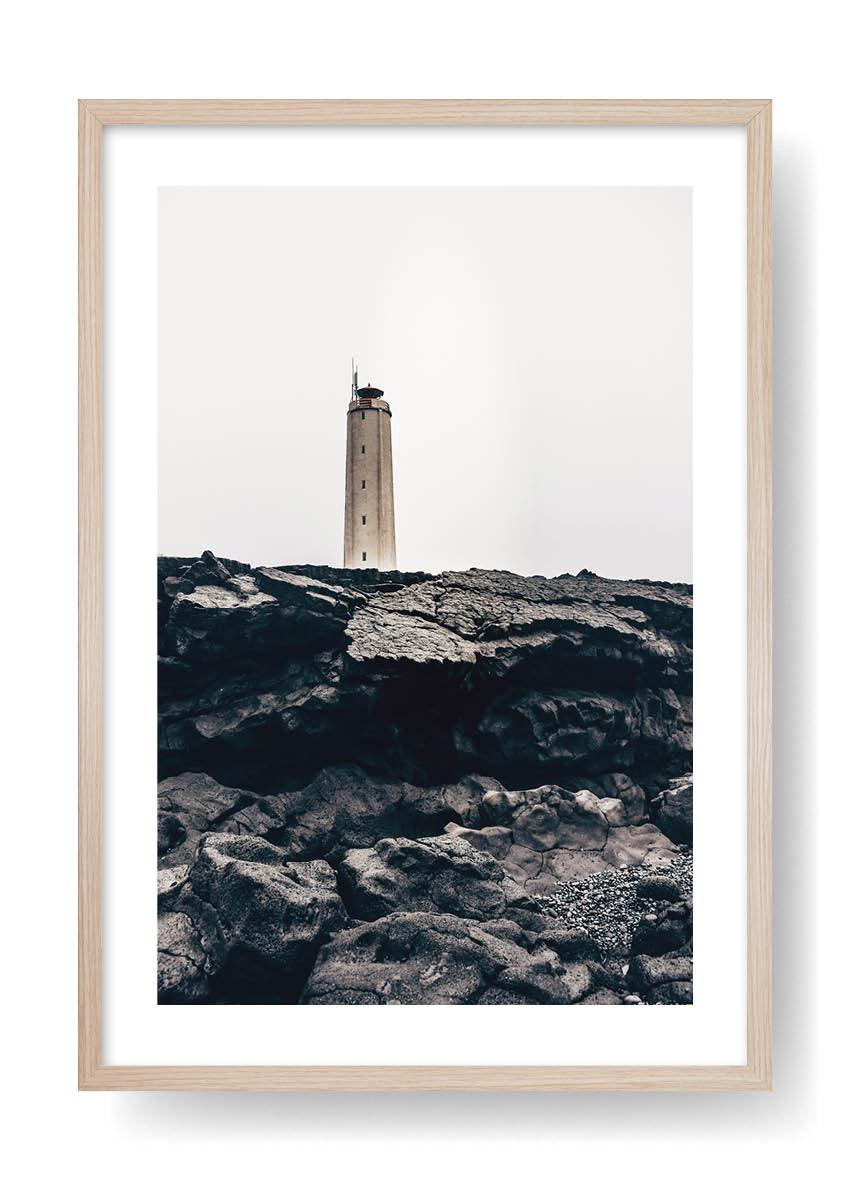 Lighthouse On Top Of Black Rocks