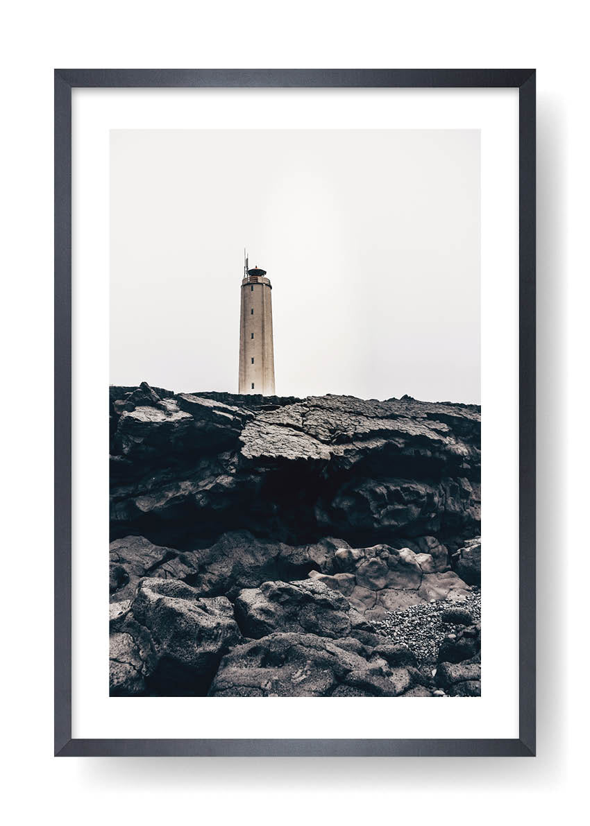 Lighthouse On Top Of Black Rocks